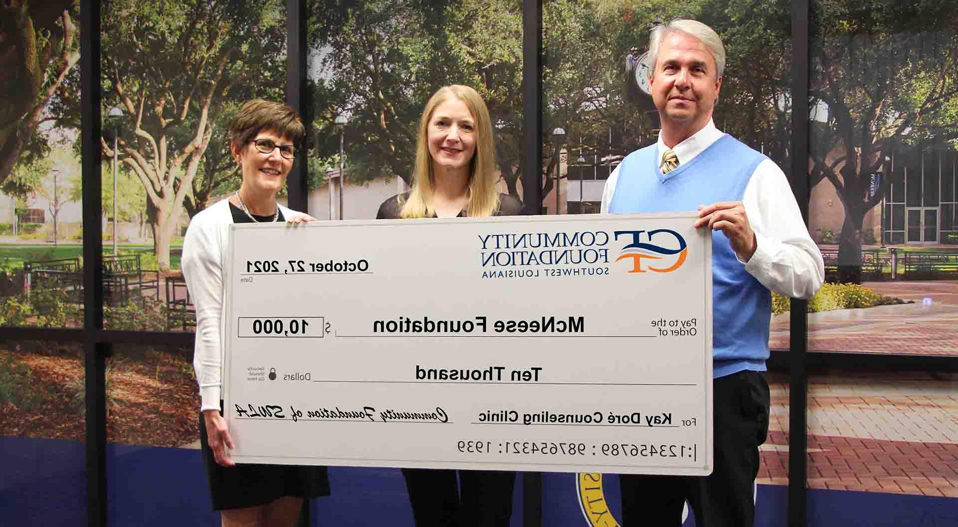 On hand for the donation are, from left, Dr. Wade Rousse, McNeese vice president for university advancement, April Broussard, operations director for the Kay Doré Counseling Clinic and Sara McLeod Judson, president and CEO of the Community Foundation of Southwest Louisiana. McNeese Photo